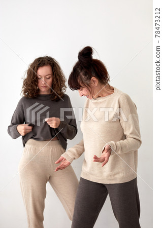 Female models in casual woolen clothes white background 78473212