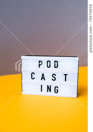 Lightbox with text podcasting in minimalistic isometric style. Trendy colors. Grey and yellow. New technologies. Millenial. Blogger, podcaster. Podcasting lettering Lightbox with text podcasting in minimalistic isometric style. Trendy colors. Grey and yellow. New technologies. Millenial. Blogger, podcaster. Podcasting lettering 78474858