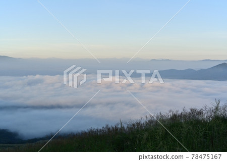 A sea of clouds over Lake Yamanaka in Mt. Myojin or the blue sky 78475167