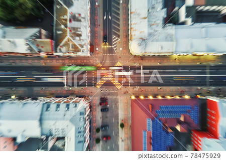 Crosroad in the city with blurred cars Crosroad in the city with blurred cars 78475929