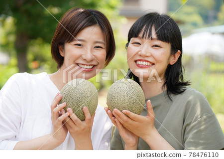 A woman with a melon A woman with a melon 78476110