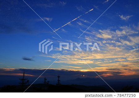 View from Mt. Wanitsuka, clouds in the sunset sky, contrails, and steel towers View from Mt. Wanitsuka, clouds in the sunset sky, contrails, and steel towers 78477250