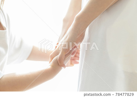Parent and child connecting hands 78477829