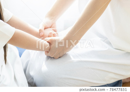 Parent and child connecting hands 78477831