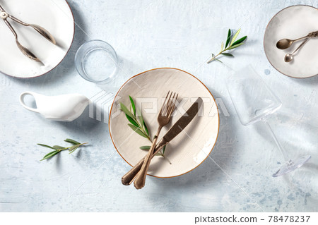 Modern tableware, overhead flat lay shot with olive branches 78478237
