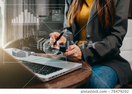 Businesswomen or Designer using tablet with laptop and document searching for information on desk in modern office with virtual interface graphic icons network diagram. Businesswomen or Designer using tablet with laptop and document searching for information on desk in modern office with virtual interface graphic icons network diagram. 78479202