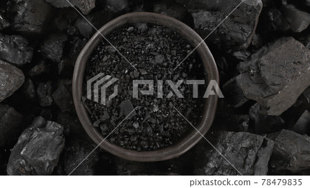 Black charcoal texture background, close-up. 78479835