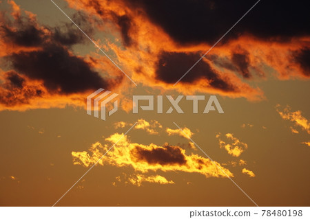 Clouds shining in the sunset 78480198