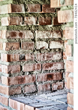 Observation window in the brick wall of the fortress for firing a gun with Observation window in the brick wall of the fortress for firing a gun with 78482414