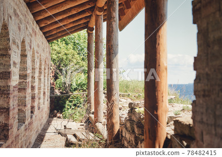 Fragment of the old fortress wall with windows overlooking the sea coast Fragment of the old fortress wall with windows overlooking the sea coast 78482415