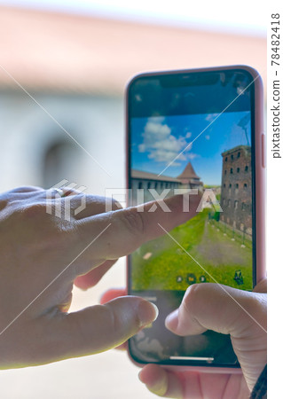 Taking a photo on a smartphone while traveling. Fortress Oreshek Taking a photo on a smartphone while traveling. Fortress Oreshek 78482418