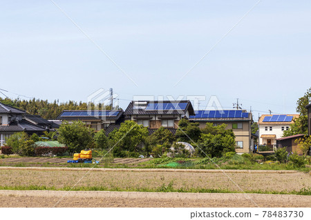 Eco-house and countryside landscape Solar panel Green sky 78483730