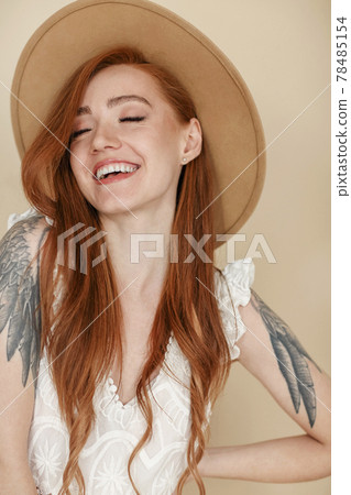 Cheerful woman with ginger hair Cheerful woman with ginger hair 78485154