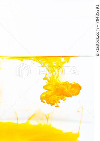 Yellow ink splashes into the water. 78485291