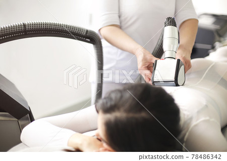 Crop woman having lipomassage in salon 78486342