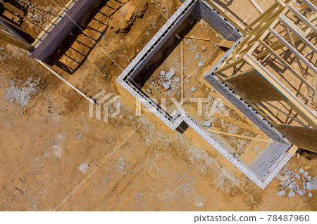 Beam wood framework of new residential home under construction Beam wood framework of new residential home under construction 78487960