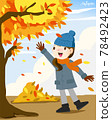 Girl walking in autumn leaves 78492423
