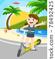 Girl riding kick scooter at beach  78492425
