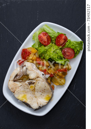 boiled fish with vegetables and fresh salad on white dish boiled fish with vegetables and fresh salad on white dish 78492517