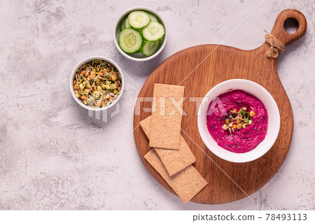 Roasted Beet Hummus in a bowl. Roasted Beet Hummus in a bowl. 78493113