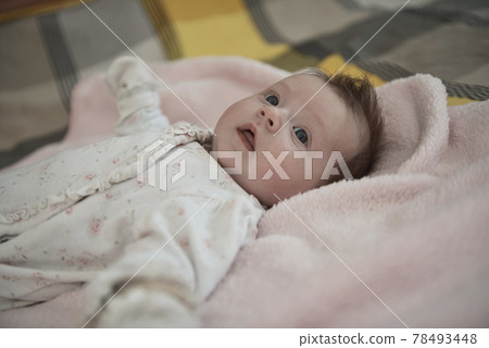 happy newborn little baby smilling 78493448