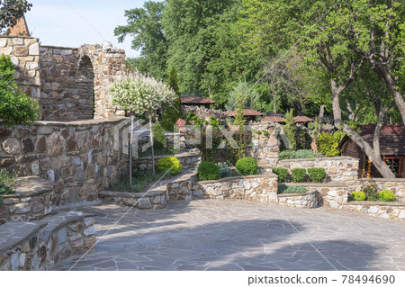 the area near the stone castle with green spaces 78494690