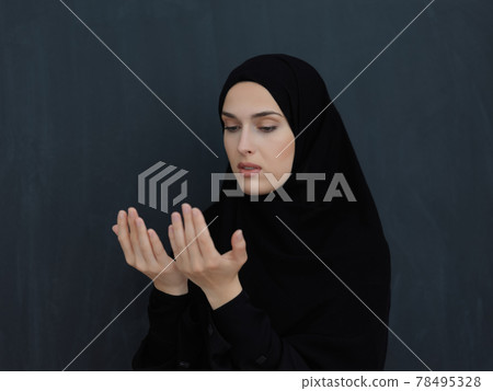 Portrait of young Muslim woman making dua Portrait of young Muslim woman making dua 78495328