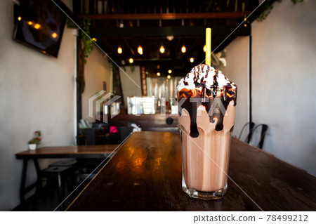 Chocolate frappe served with whipped cream and chocolate syrup. Chocolate frappe served with whipped cream and chocolate syrup. 78499212