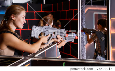 young people with plastic laser guns 78502912