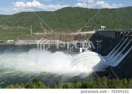 A long plume of water discharged from a hydroelectric power plant. A long plume of water discharged from a hydroelectric power plant. 78504101