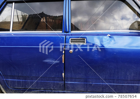 Car of the Russian manufacture after a crash with dents scratches and defects of the body part Car of the Russian manufacture after a crash with dents scratches and defects of the body part 78507654