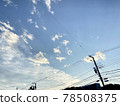 Evening sky and utility poles 78508375