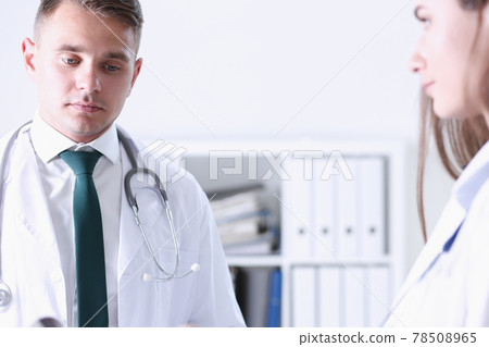 Group of medicine doctors talking during conference Group of medicine doctors talking during conference 78508965