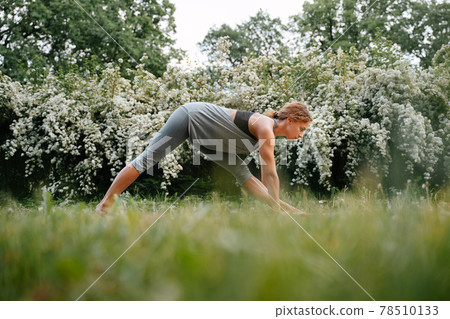 Young woman goes in for sports outdoors. Young woman goes in for sports outdoors. 78510133