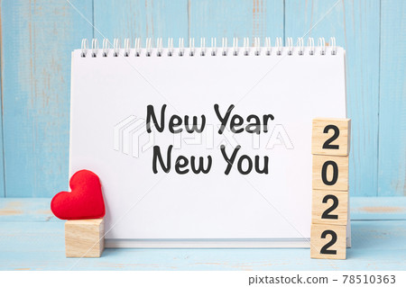 New Year New You words and 2022 cubes with red heart shape decoration on blue wooden table background. Goal, Resolution, health, Love and Happy Valentine day concept New Year New You words and 2022 cubes with red heart shape decoration on blue wooden table background. Goal, Resolution, health, Love and Happy Valentine day concept 78510363