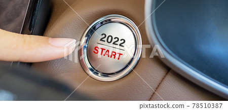 Finger press a car ignition button with 2022 START text inside modern electric automobile. New Year New You, resolution, change, goal, vision, innovation and planning concept 78510387