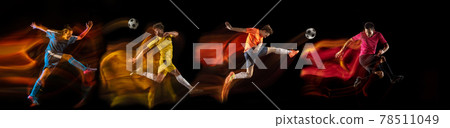 Sportsmen playing soccer football on black background in mixed light. Caucasian fit young male players in motion or action 78511049