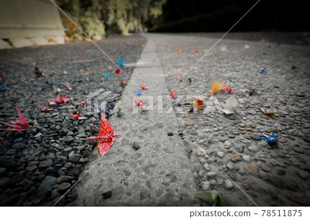 Rolling up a thousand paper cranes 78511875