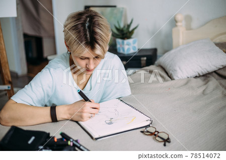 Woman artist drawing sketch. Female artist creates a sketch. 78514072