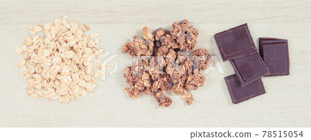 Granola, oat flakes and chocolate, healthy food for breakfast concept 78515054