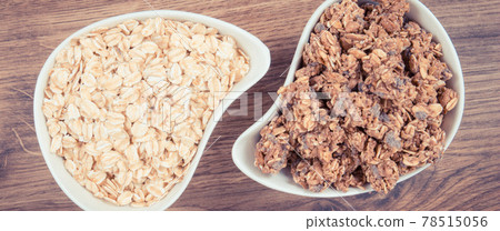 Oat flakes and granola with chocolate as source iron and fiber, healthy snack concept 78515056