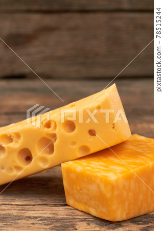 Two pieces of fresh cheese. 78515244