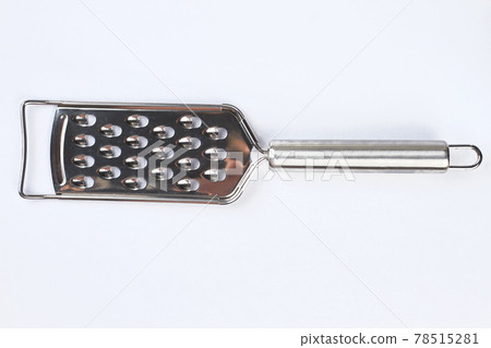 Cheese grater isolated on light background. Cheese grater isolated on light background. 78515281