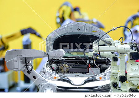 Industrial robotic working with automobile on blurred smart car factory background, robot work instead of human, industry 4.0 and AI concept 78519040
