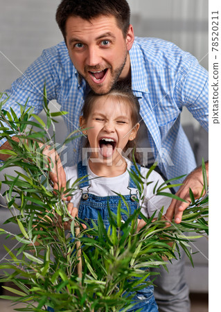 father playing with excited happy little child girl 78520211