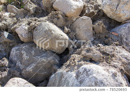 Rockfall on the road in the mountains. Stones of different sizes. Landslides. 78520693