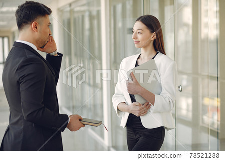 Businessman with his partner working in a office 78521288