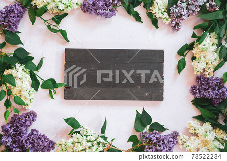 The beautiful lilac on a wooden surface The beautiful lilac on a wooden surface 78522284