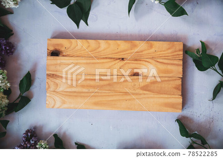 The beautiful lilac on a wooden surface The beautiful lilac on a wooden surface 78522285