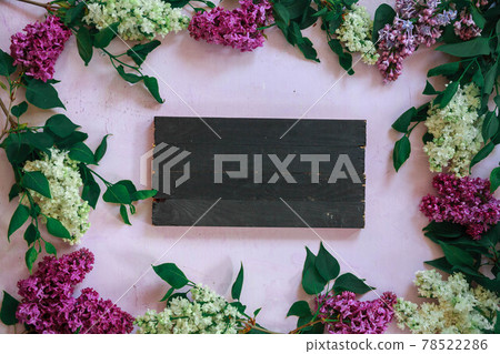 The beautiful lilac on a wooden surface The beautiful lilac on a wooden surface 78522286